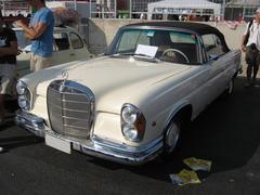Mercedes-Benz 280 SE Cabriolet W112 classic car in white at Imola Circuit Italy