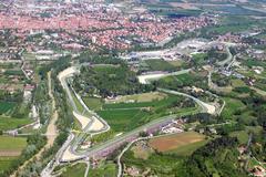 Aerial view of Imola Circuit racetrack surrounded by greenery