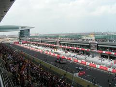 View from main grandstand to pit lane with futuristic control area on left at Shanghai Formula 1 circuit