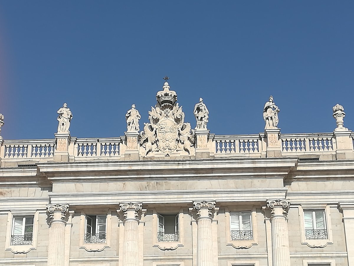 Balustrade of the Royal Palace of Madrid featuring coat of arms of Philip V with Orders of Golden Fleece and Holy Spirit, flanked by statues of Visigothic kings