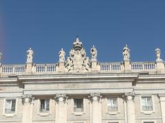 Balustrade of the Royal Palace of Madrid featuring coat of arms of Philip V with Orders of Golden Fleece and Holy Spirit, flanked by statues of Visigothic kings