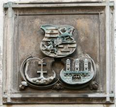 Relief on Michalska Gate in Bratislava featuring the coats of arms of the city, Hungary, and the Jagiellons