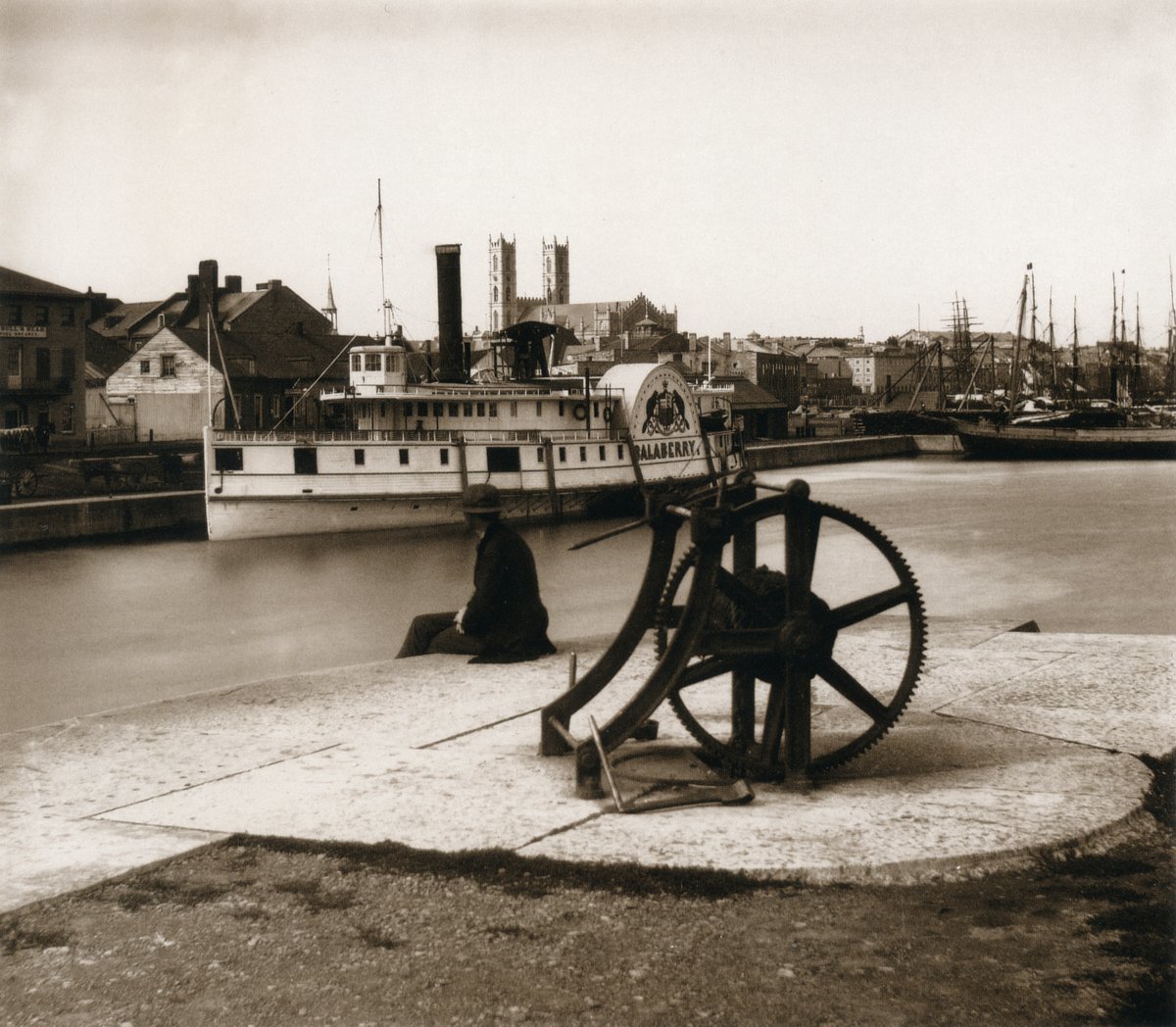 Salaberry riverboat moored on Lachine Canal Montreal with Notre Dame Basilica in background