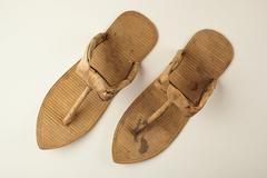 Pair of ancient Egyptian sandals with intricate woven design