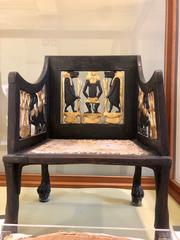 Gilded ancient Egyptian chair displayed in Cairo's Egyptian Museum