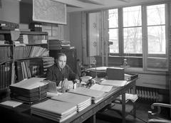 Portrait of Karl Alfred Gustawsson in his office at Nationalmuseum building housing the Historical Museum's antiquities department