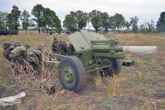 Military personnel from Moldova, Romania, and the U.S. conducting a multinational artillery exercise at Bulboaca Training Area