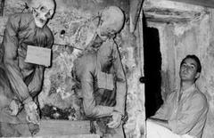 Enrico Colombotto Rosso in the Catacombs of the Capuchin Friars, Palermo, 1957