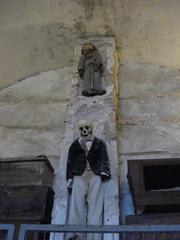 Men's corridor inside the Capuchins' Catacombs with rows of skeletal remains