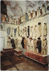 Postcard image of the children's section in the Capuchin Catacombs, Palermo, showing mummified children arranged behind glass