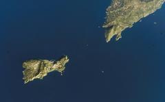 Aerial view of the island of Capri with cliffs and blue sea