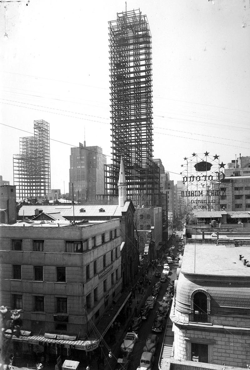 Vintage photograph of Mexico City's Francisco I. Madero Street around 1951 with bustling street activity and historic buildings