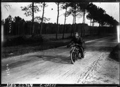 Motorcycle race at Circuit de la Sarthe featuring Alexander on Douglas bike at high speed