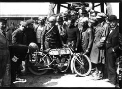 Vintage motorcycle racing at Circuit de la Sarthe with racer G. Joly on Alcyon after victory