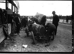 Bugatti car refueling at Circuit de la Sarthe race in 1920 with driver Baccoli