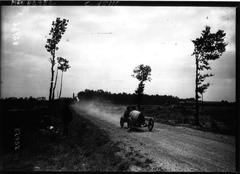 1920 vintage racing cars at Circuit de la Sarthe speeding with spectators in background