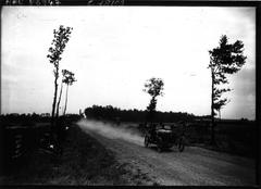 Vintage race car speeding on Circuit de la Sarthe with driver Douglas Hawkes