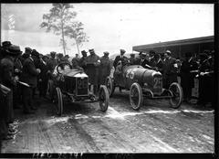 Vintage car race at Circuit de la Sarthe featuring Thomas on Silver Harok and Cartaud on Majola starting the race in 1920