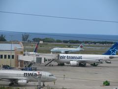 Peak hour traffic at Sangster International Airport with multiple airplanes on the tarmac