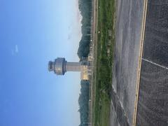 Control tower of Sangster International Airport under clear blue sky
