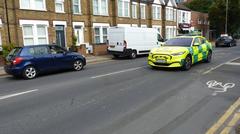 Ambulance car rushing on Kingston Road with flashing lights during emergency