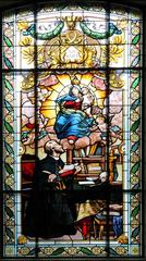Stained glass window depicting Saint Peter Canisius and the Assumption of Mary in the basilica of Our Lady, Fribourg, Switzerland