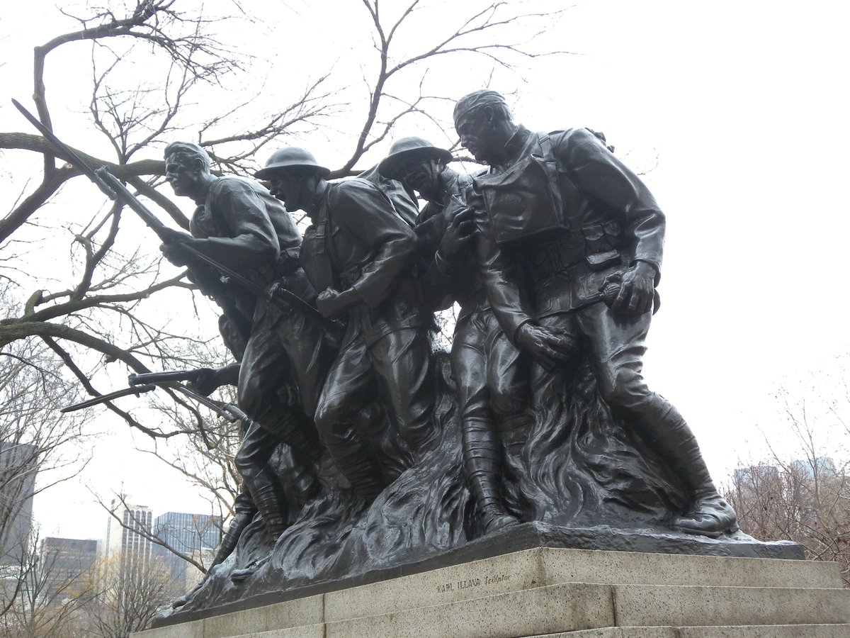 World War I memorial for the 7th New York Militia Regiment (US 107th) along 5th Avenue at 67th Street on a cloudy day