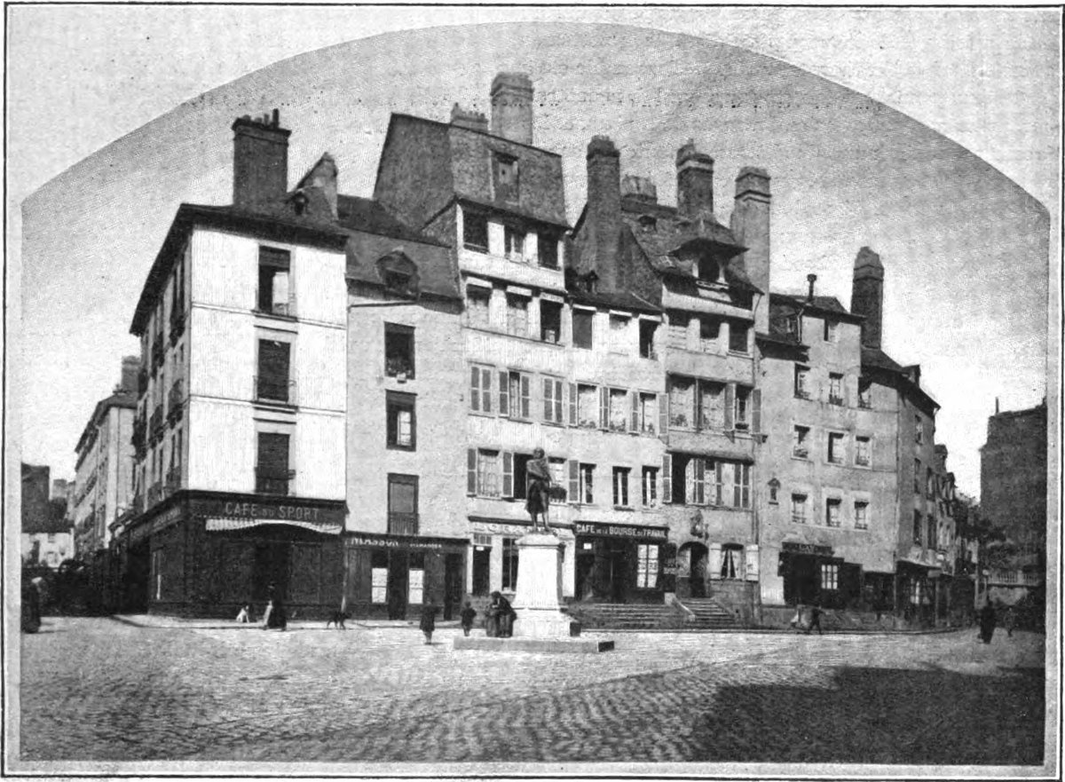 Old houses of Rennes lined up closely with traditional wooden structures and tiled roofs
