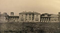 Heaton Hall in Manchester around 1908 seen from a distance with surrounding trees and landscape