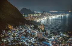 View of Vidigal favela in Rio de Janeiro Brazil with colorful houses on hills under bright blue sky