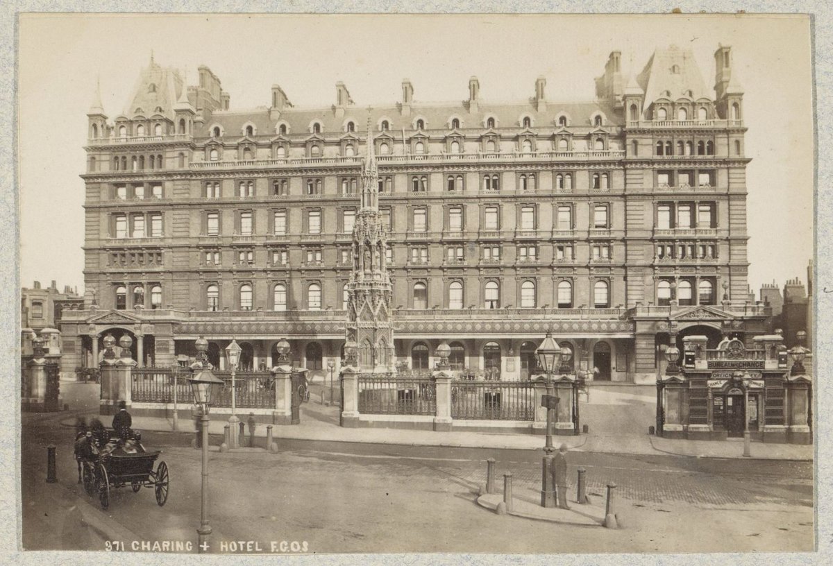 Historic Charing Cross Station and Hotel with replica of Eleanor Cross monument in London circa 1880-1910