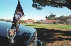 Marine One helicopter landing at the Presidio Landing Zone in San Francisco with the Presidential Limousine in the foreground