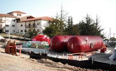 Two large 20,000-gallon water tanks at construction site for LEED Silver rated building at Presidio of Monterey