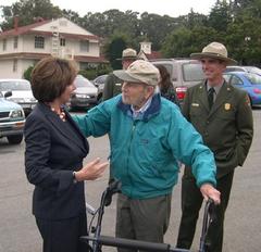Rep. Pelosi speaking with Dr. Ed Wayburn at the 10th Anniversary of Presidio Transfer celebration on October 16, 2004