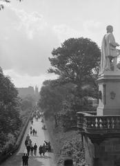 Walkers in a park in Edinburgh cityscape 1934