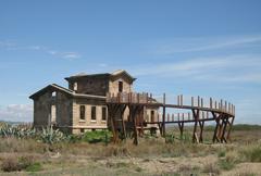 Birdwatching tower Casa Semáforo overlooking Ca l'arana beach in Delta del Llobregat Natural Reserve