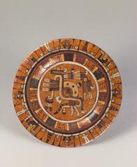 Aztec plate with intricate painted motifs