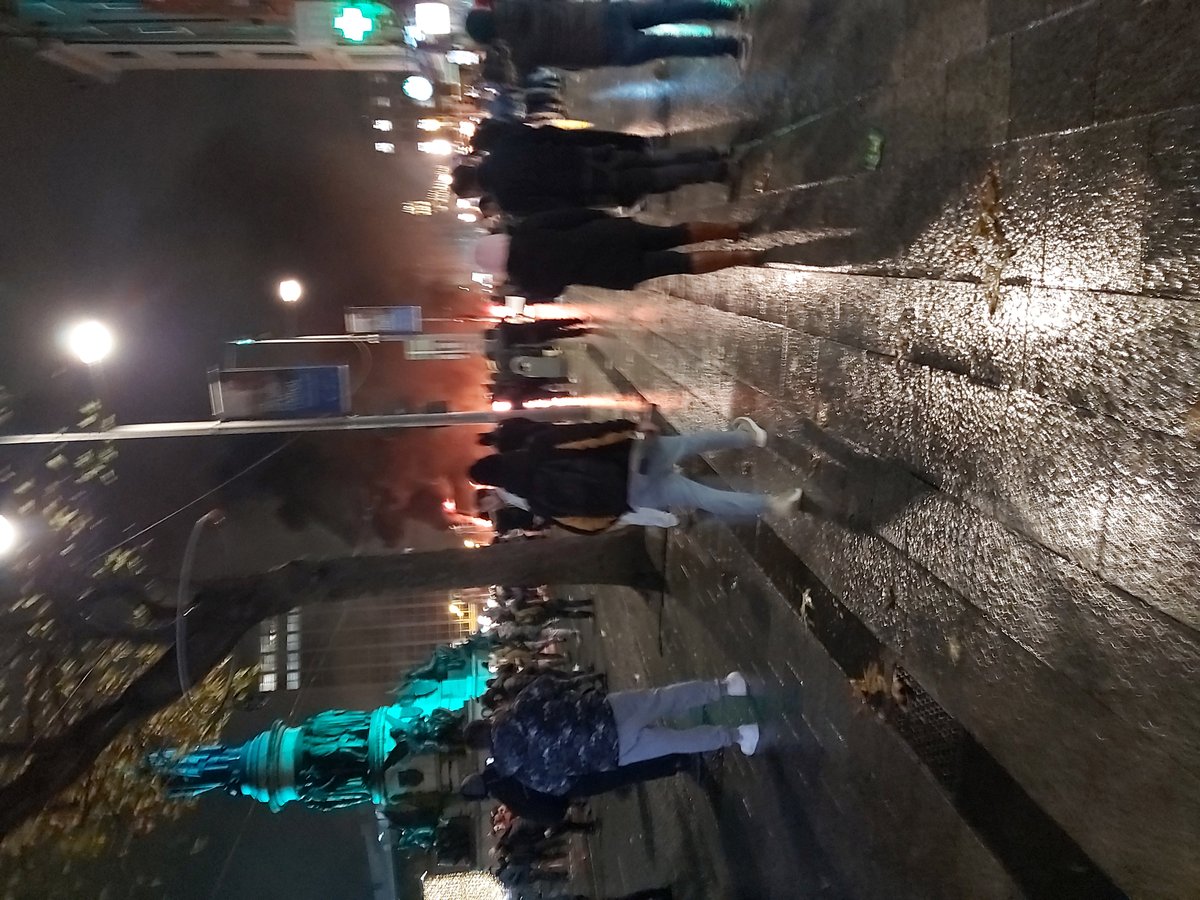 Flames and smoke rising from a burning bus and car during Dublin riot on Lower O'Connell Street