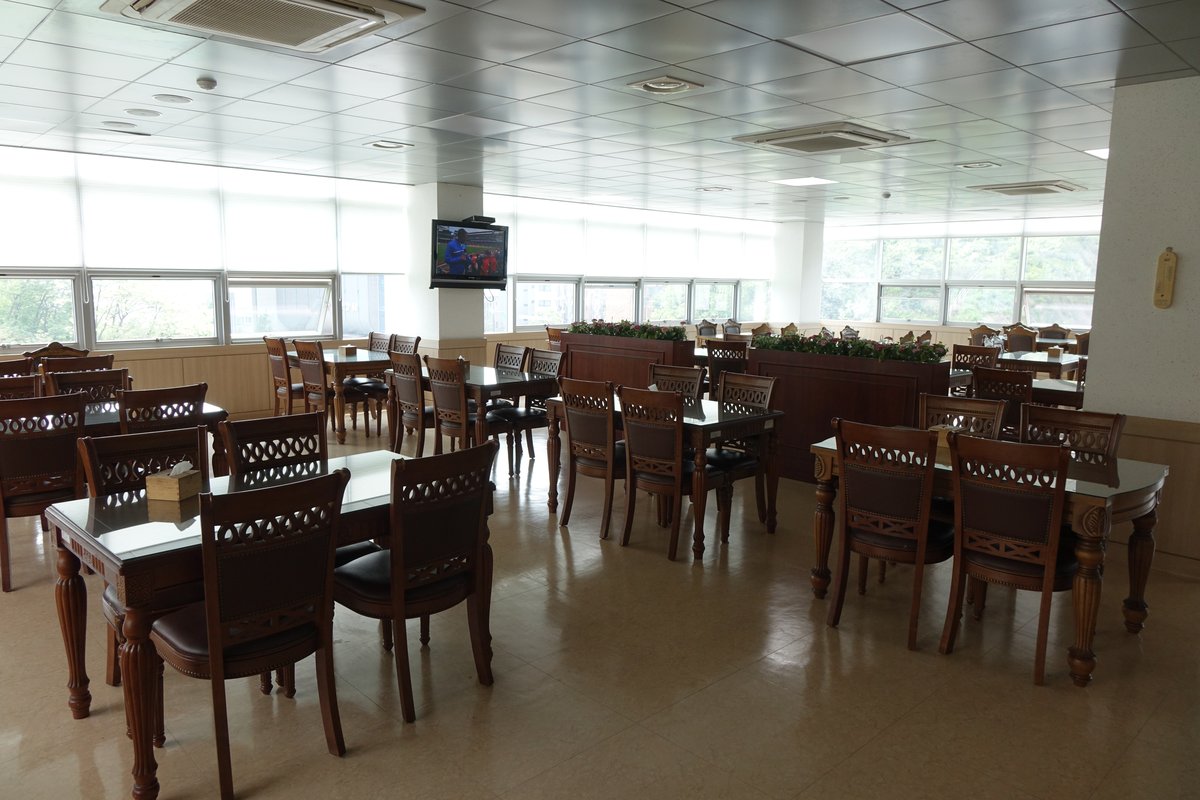 Colorful street market in South Korea with fresh vegetables and traditional buildings