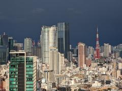 Roppongi Hills and Tokyo Tower with dark stormy sky background in Tokyo