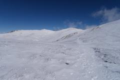 Scenic mountain view of Mount Kosciuszko and Rawson Pass along the Main Range Track in Kosciuszko National Park