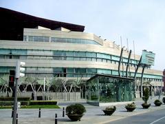 Palacio Euskalduna de Bilbao modern architecture with glass facade and reflective water pool