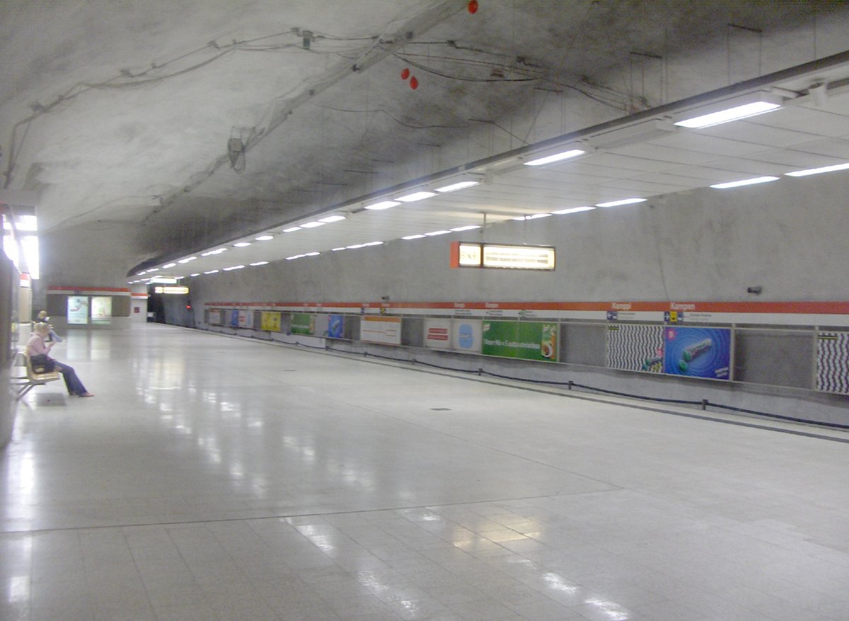 View of Kampin metro station interior with escalators and signage