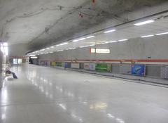 View of Kampin metro station interior with escalators and signage