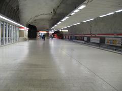 Kamppi metro station platform in Helsinki with trains and passengers