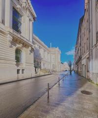 Rue Georges Clemenceau street in Nantes in February 2024 with storefronts and people walking