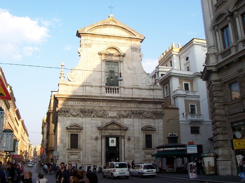 Facade of Chiesa di Santa Maria in Via in Rome on a clear day
