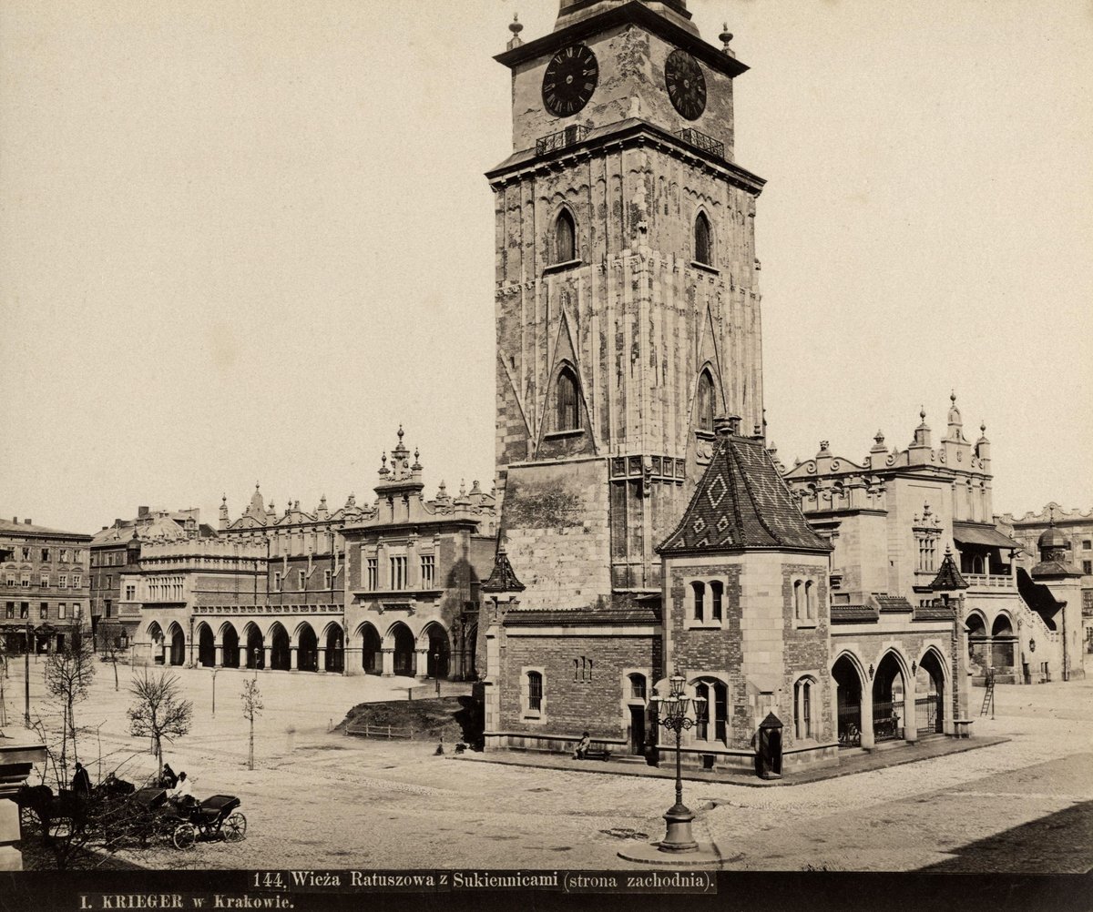 Historic Krakow Town Hall and Cloth Hall on Main Market Square with waiting horse-drawn carriages circa 1870-1890