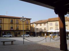 View of Berlanga de Duero village with historic buildings and castle on hill