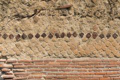 Ancient Roman wall ruins in Herculaneum Italy showing old stone construction